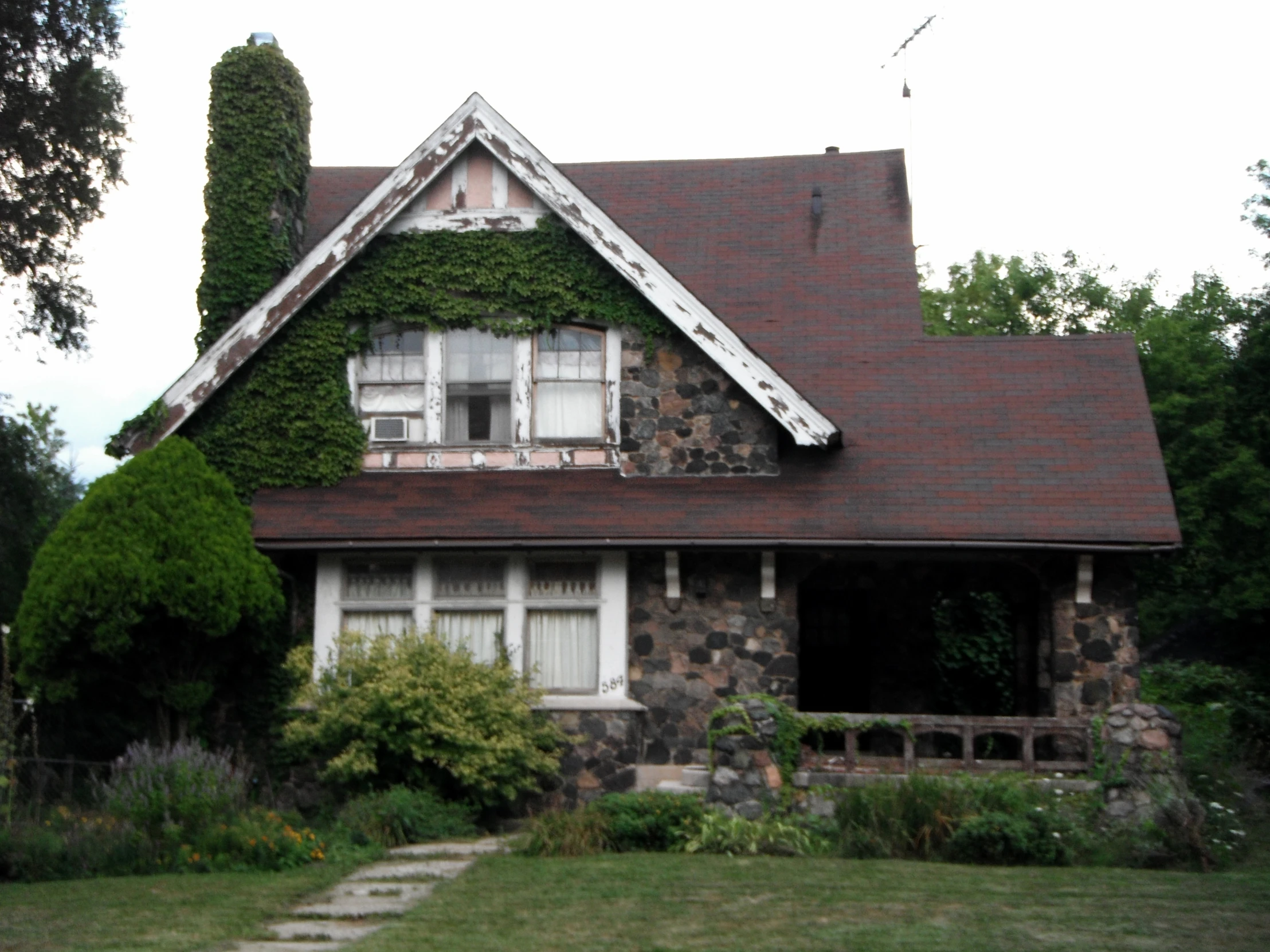 this is a house with ivy growing on it