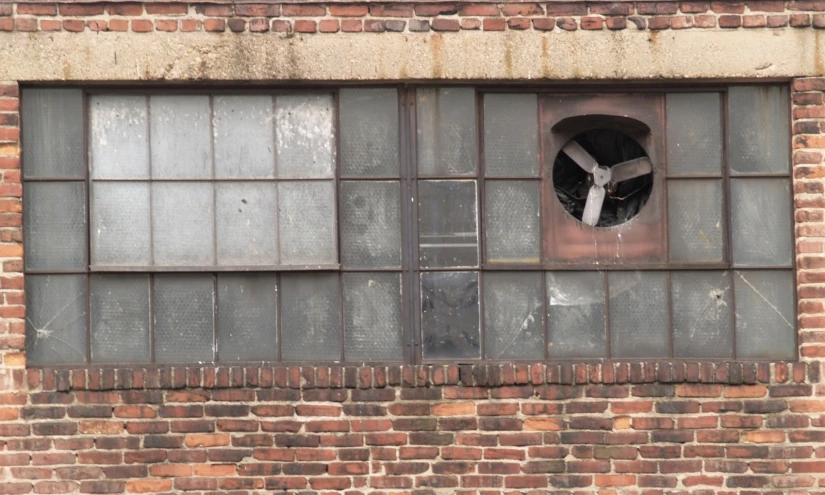 an industrial building with a round window