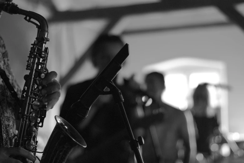 people playing musical instruments inside of an outdoor structure