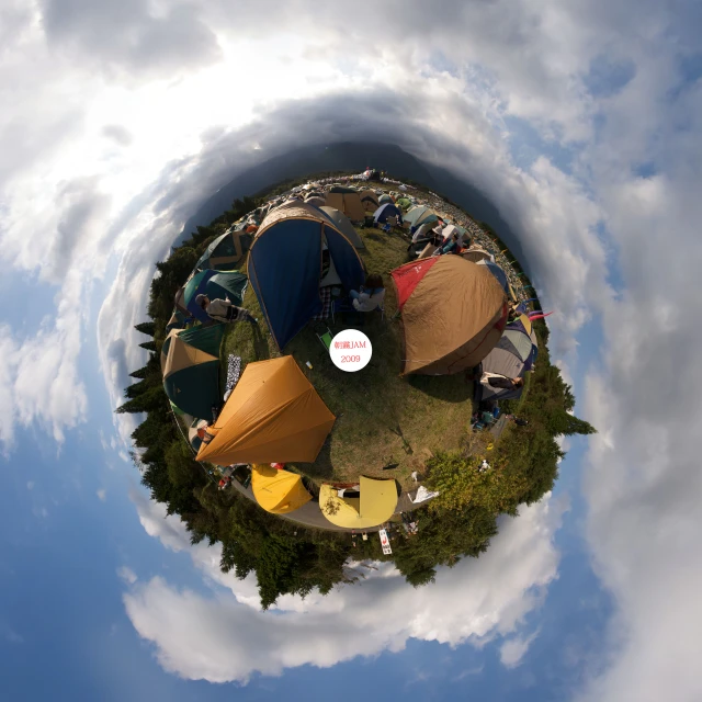 a little planet image with tents in the grass and some clouds