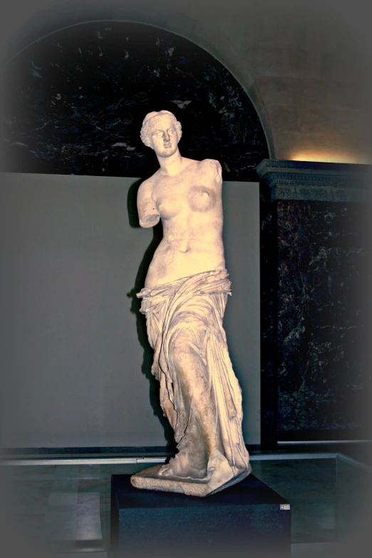 the white statue is standing on display in the room