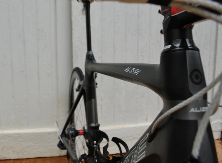 a close up view of a bicycle parked near a building