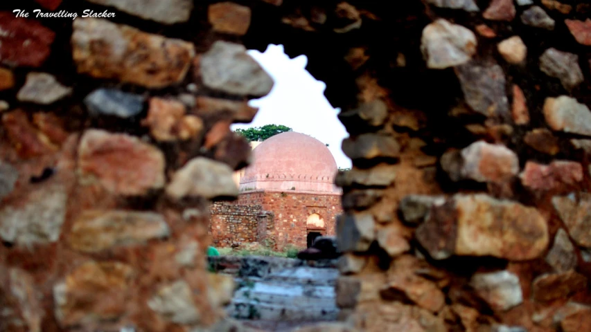 the window frame shows a view of an old building