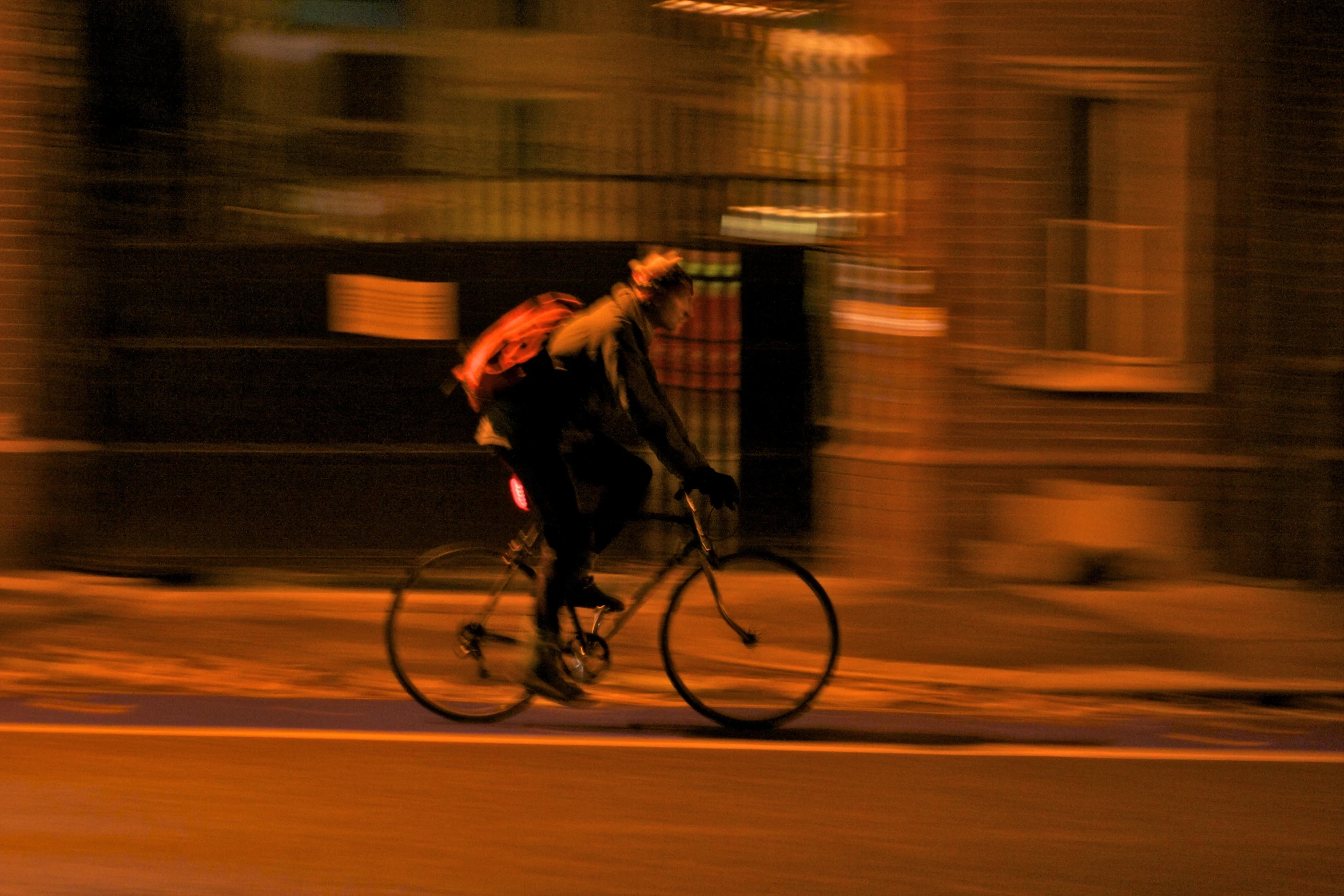 a man is riding a bike down a street