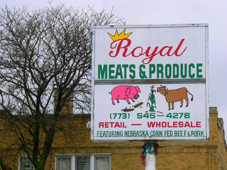 a restaurant sign on the side of the road