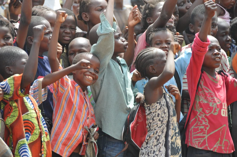 a group of children posing for the camera