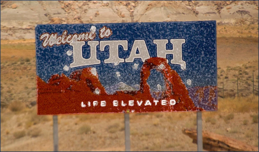 a sign on the side of a road in the desert