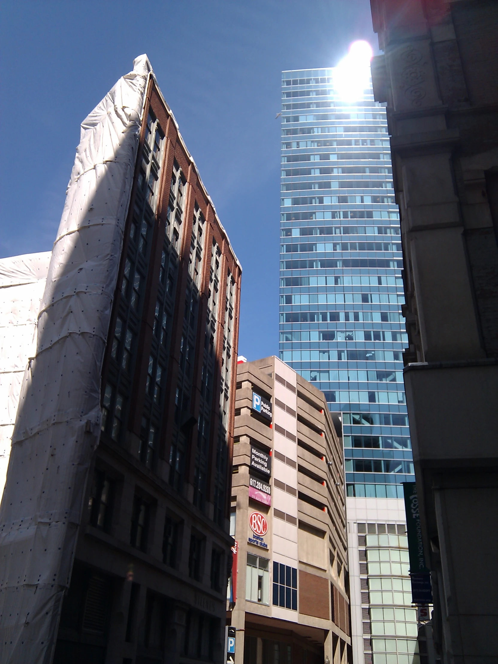 several tall buildings in the city with many windows