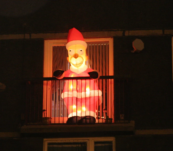 a inflatable person is standing on the balcony