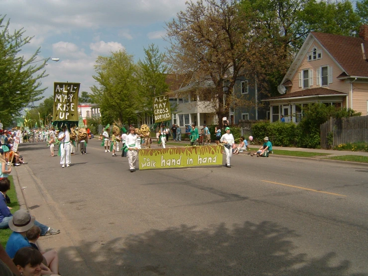 a parade is going on with a large crowd watching