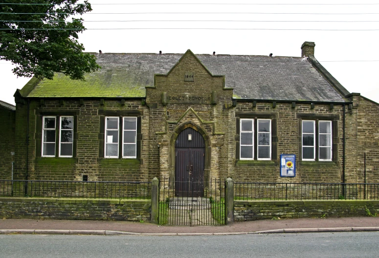 a building with a clock on the front and door