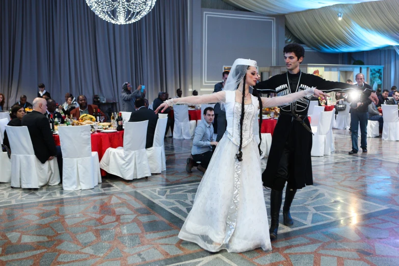 a newly married couple dance at their wedding reception