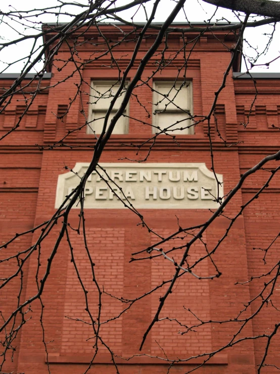 a building made from red bricks and a sign that reads museum de house
