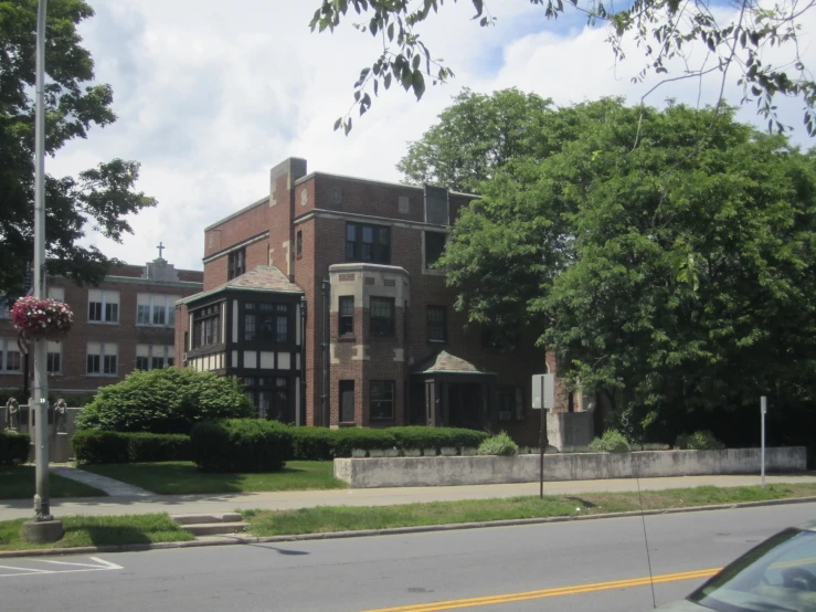 a very big pretty building on the side of a road