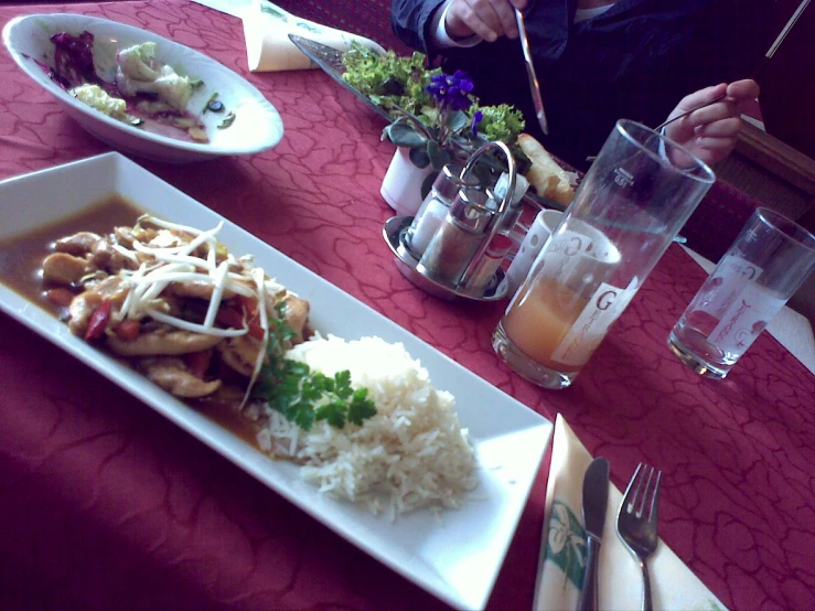 a person  up food on top of a white plate