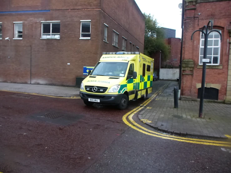 an ambulance parked by the curb on a city street