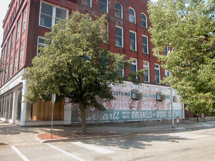 an old building is seen from the street