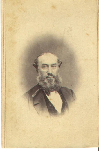 an old pograph of a man with a beard and moustache