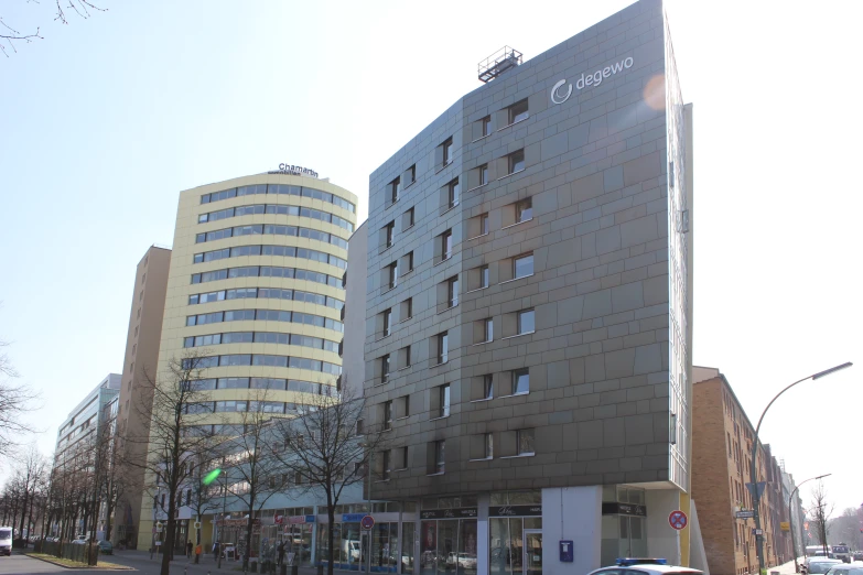 two buildings, one of which is shaped to look like a crosswalk