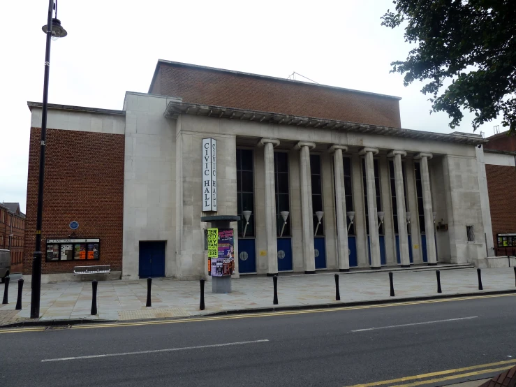 a large white building with windows sitting on the side of it