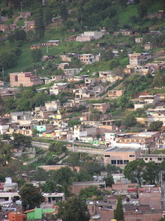 a large city is shown on a hillside