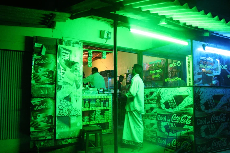 a man in a white suit is outside a business