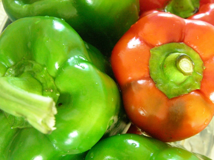 several bell peppers arranged neatly together in the same pile