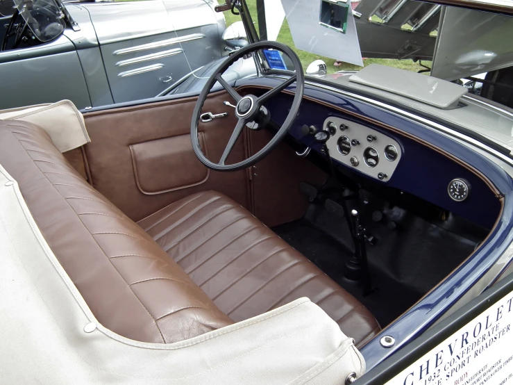 an old classic car dashboard and driver's cockpit