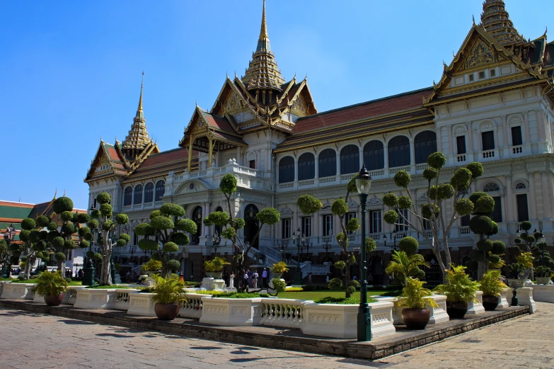 ornate building with many balconies and trees