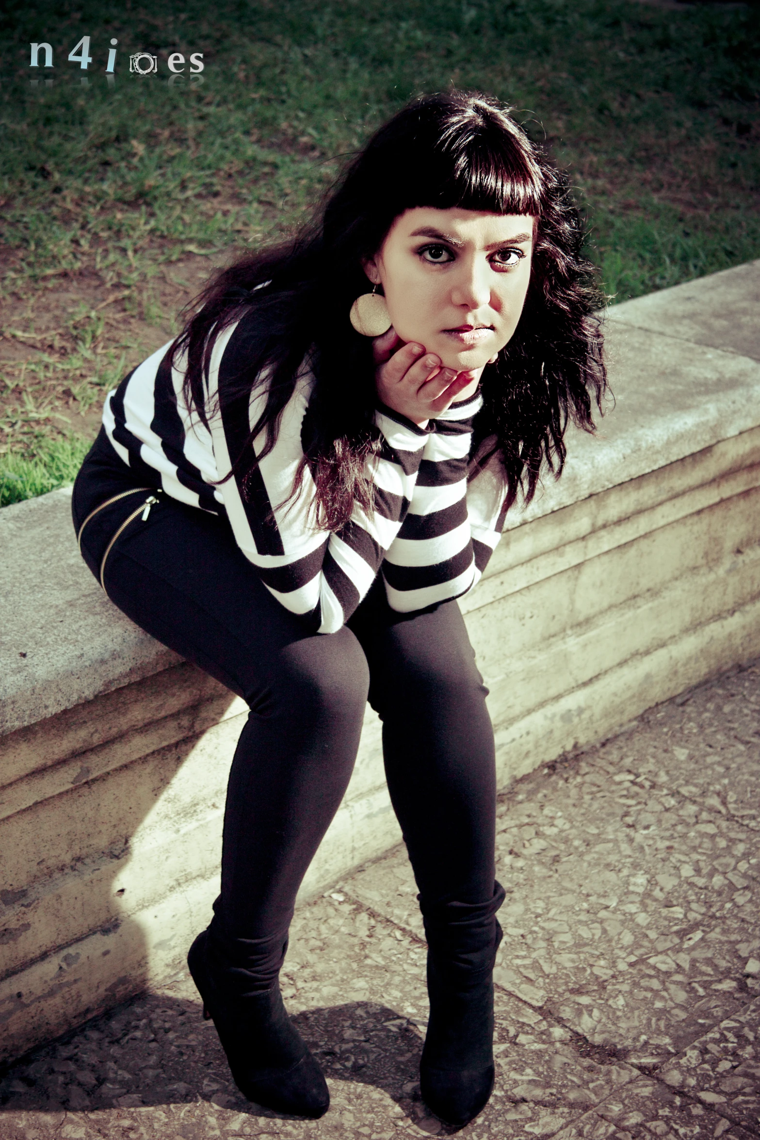 the young woman is riding her skateboard on the ledge