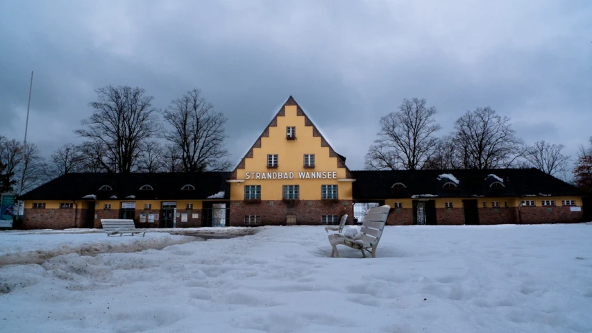 the yellow building has been located in the snow