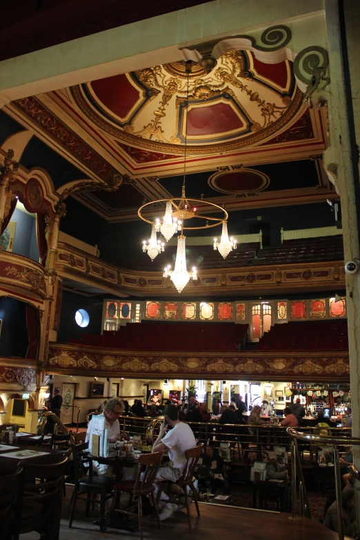 the ceiling inside a bar is made of colorful paint