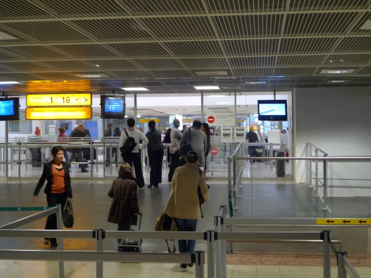 many people who are walking around at the airport