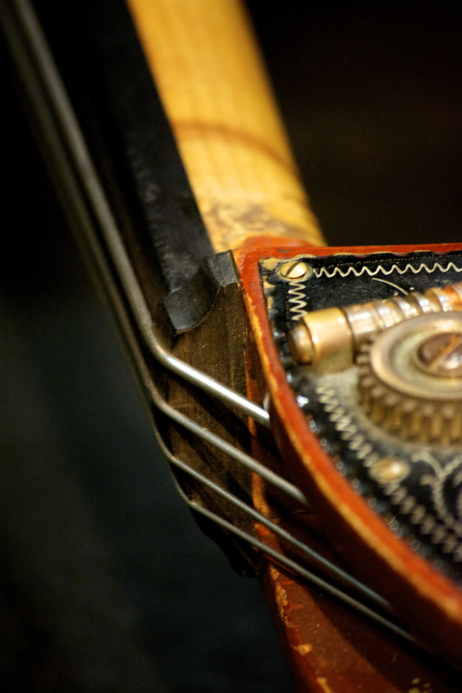 a close up of a piece of wooden with writing and metal detailing