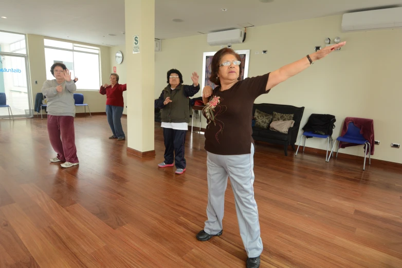 some people standing around in an empty room