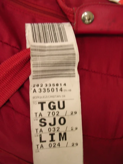 a ticket showing a red shirt with red and white tags