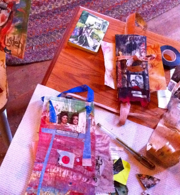 assorted papers, magazines, and some items on a table