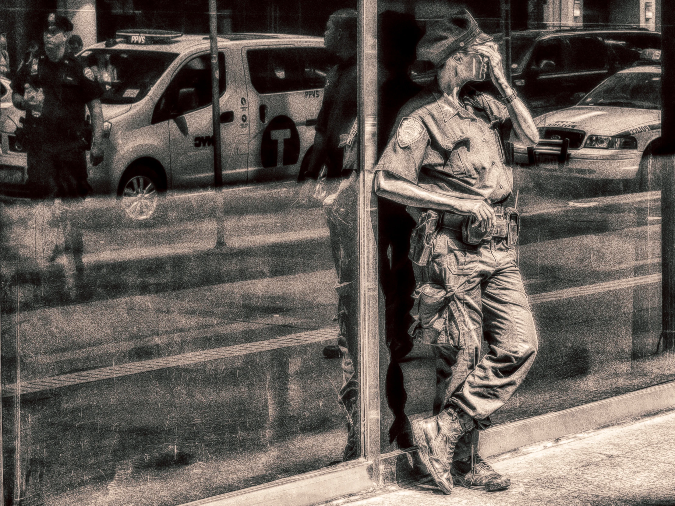 a man standing in front of a window, wearing all kinds of clothing