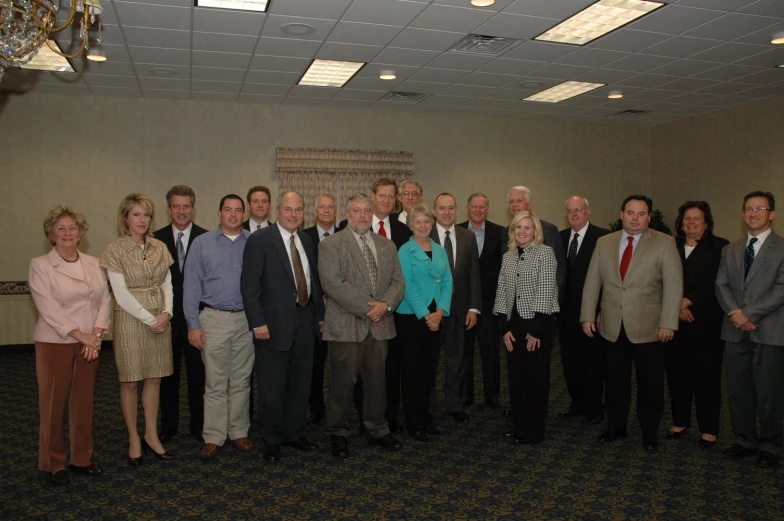 a large group of business people in a office