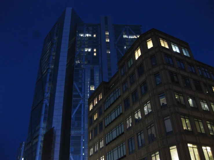 a tall building sitting in the middle of a night time