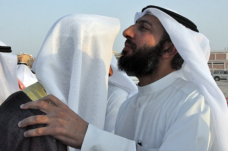 a man in a traditional outfit looks at soing