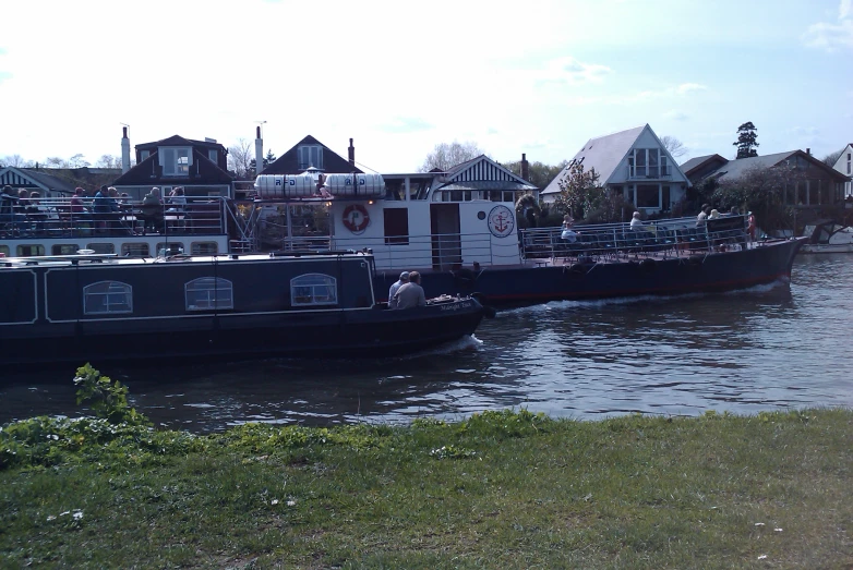 a couple of boats floating on top of a body of water