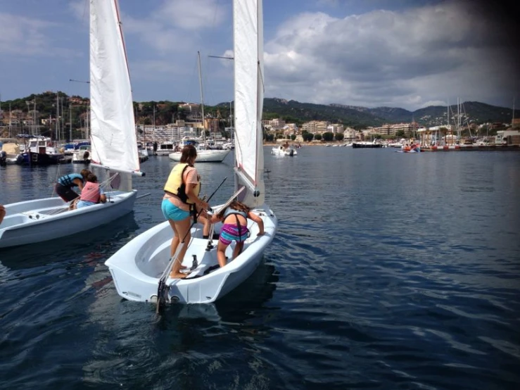 a group of people that are standing on a boat