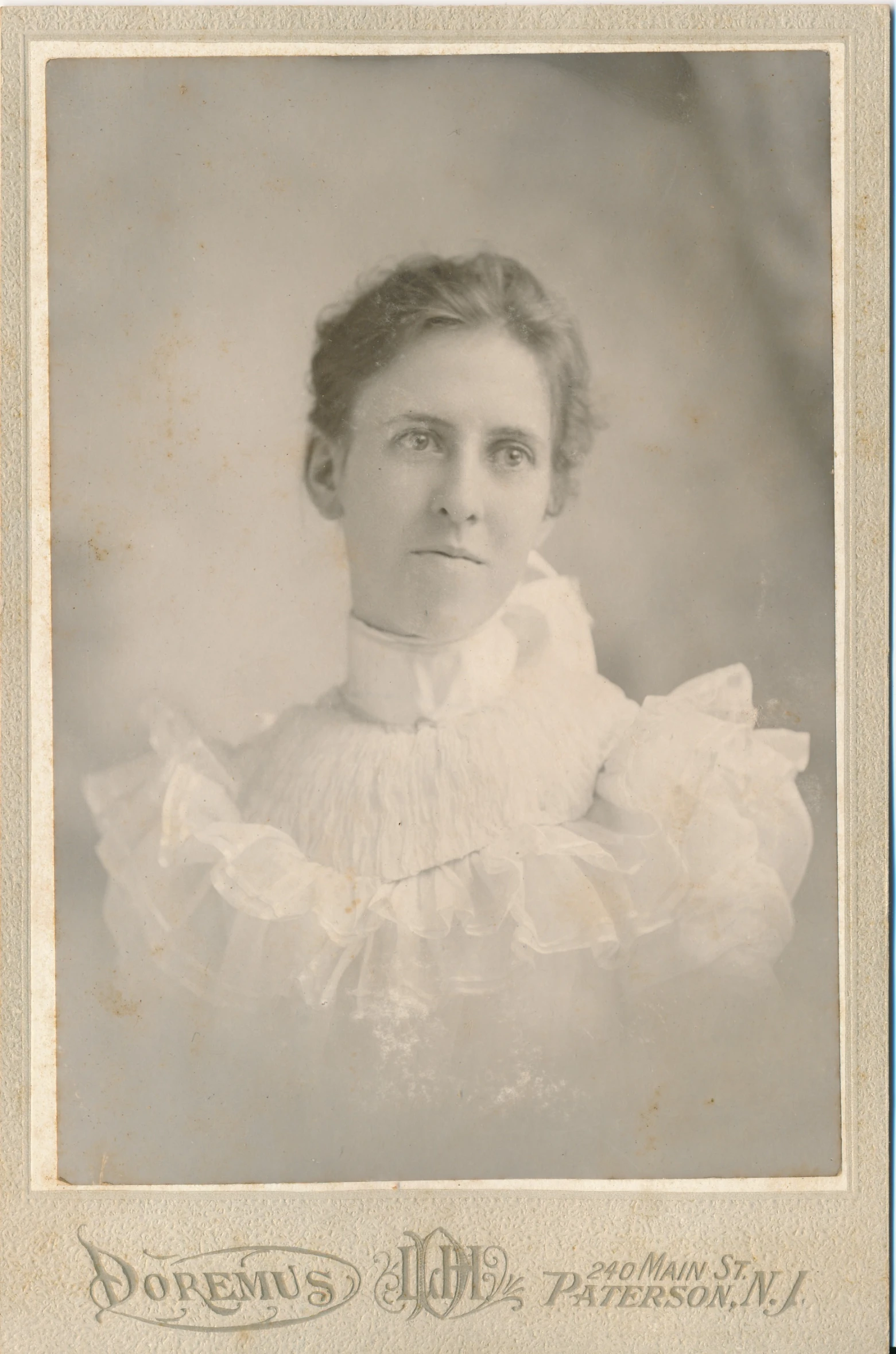 a woman with long hair, in a white dress