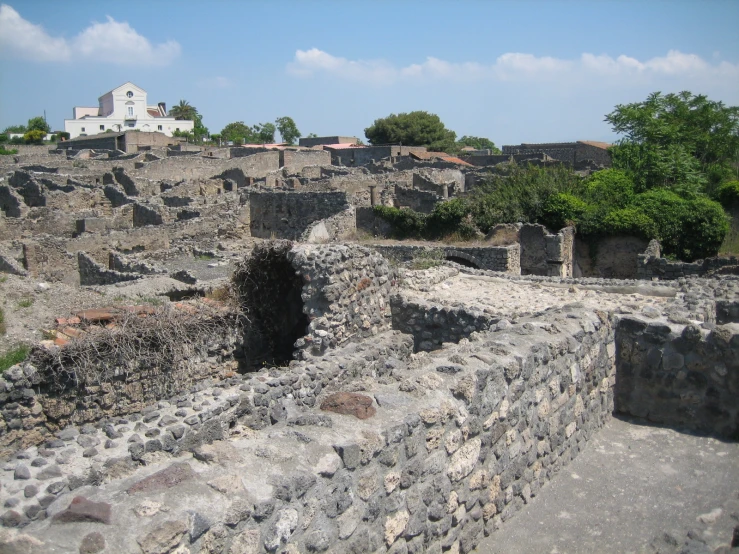 there are some buildings sitting among the rubble