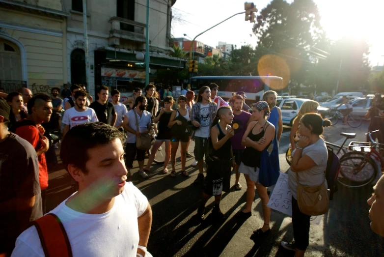 a crowd of people walking down the street