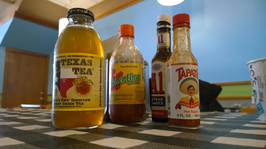 a group of different types of beverages on a table