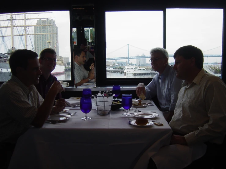 a group of men sit at a table