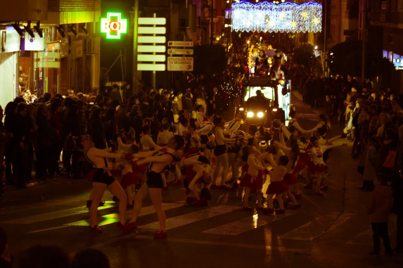 a group of dancers in front of a crowd