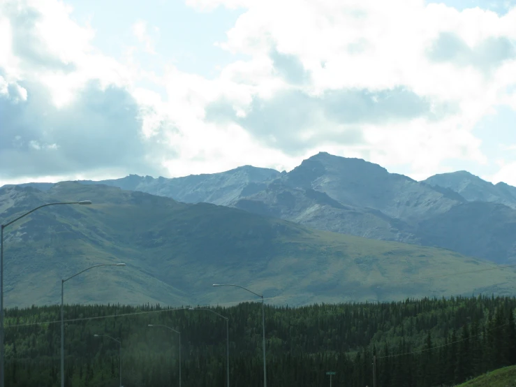 mountains are in the background with clouds moving over them